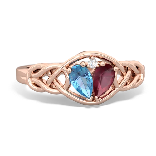 blue topaz-ruby celtic knot ring