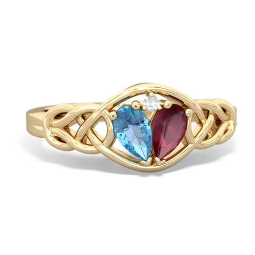 blue topaz-ruby celtic knot ring